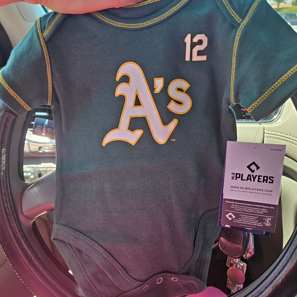 Genuine Merchandise Green Baby Onesie